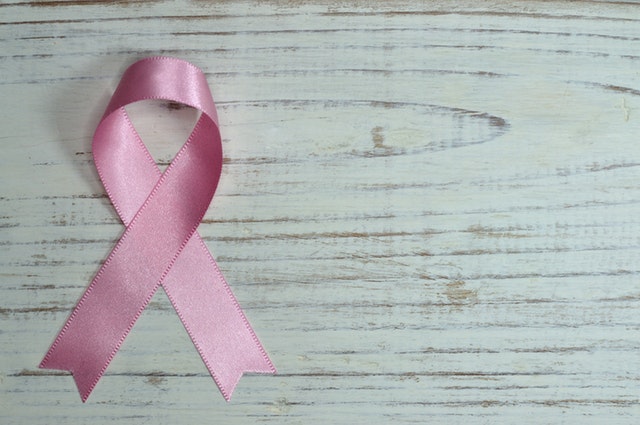 a pink ribbon worn for breast cancer awareness